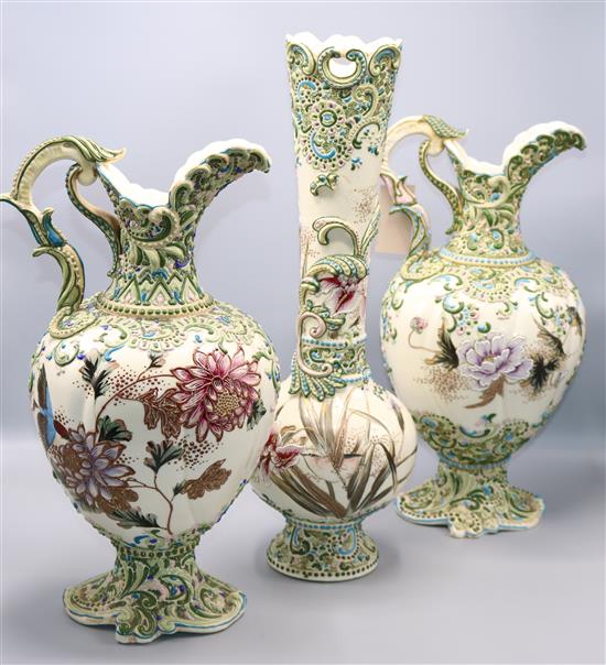 Pair Moriage ewers in a vase